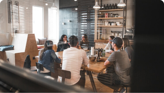 people having meeting on a table